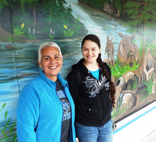 8-19-13 Tammie Wales, right, poses with at Kathy Randrup new Trading Union mural.