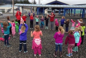 Girl Scouts sing songs outside Rae Stedman Elementary School during a week-long camp. Photo/Angela Denning